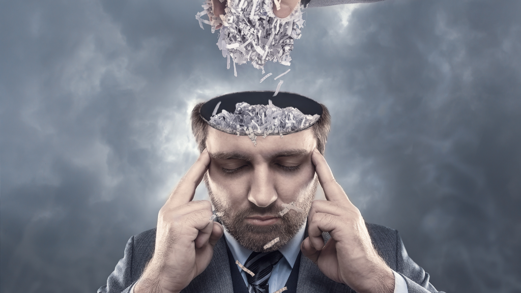 Man with a head full of shredded paper and fog