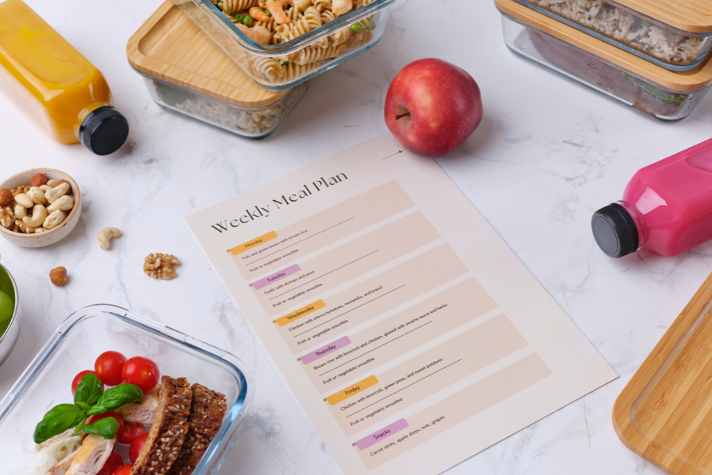 Flat lay of fresh snacks, fruits, supplements, and a water bottle on a table, representing nutrition, hydration, and wellness for maintaining physical and mental health.