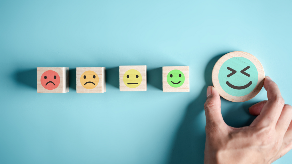 Wooden blocks cycling through the different emotions