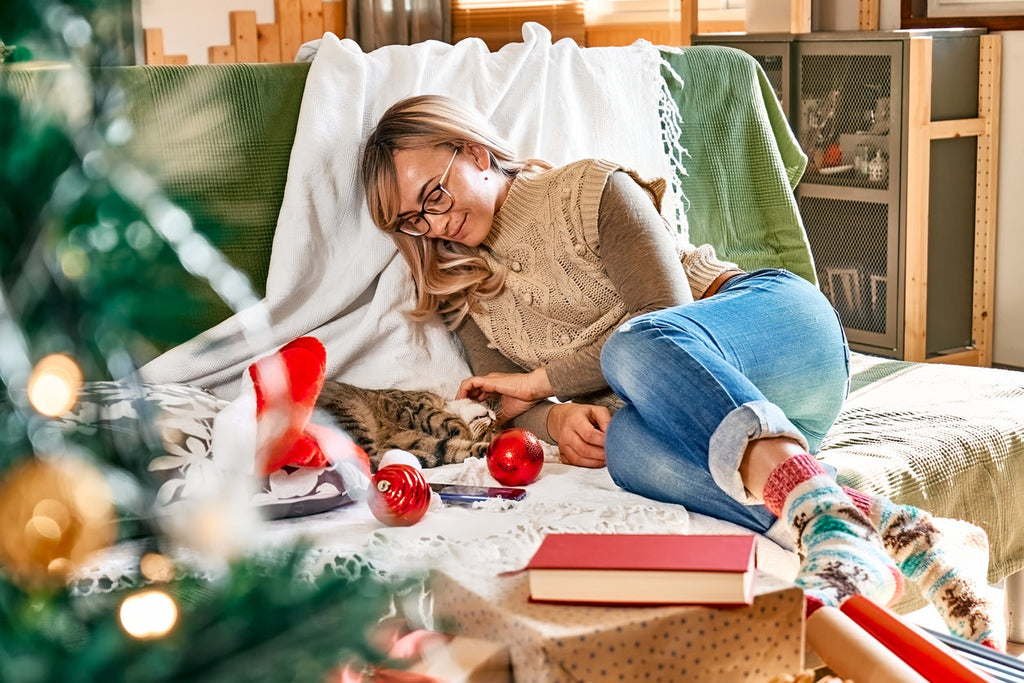 Finding time to relax and take a break from the holiday stress by laying down with cat
